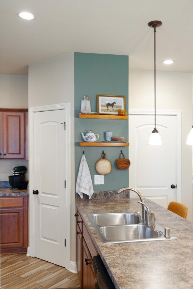 112 Woods Point Cir, Georgetown, KY 40324 - kitchen with a sink, light wood-style floors, brown cabinets, hanging light fixtures, and recessed lighting