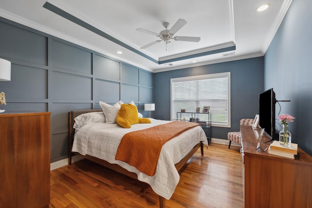 112 Woods Point Cir, Georgetown, KY 40324 - bedroom with a tray ceiling, ornamental molding, wood finished floors, recessed lighting, and a decorative wall