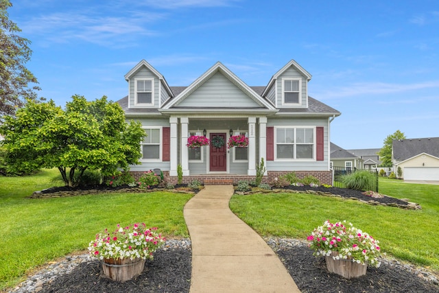 112 Woods Point Cir, Georgetown, KY 40324 - view of front facade with a front yard, a shingled roof, and a porch