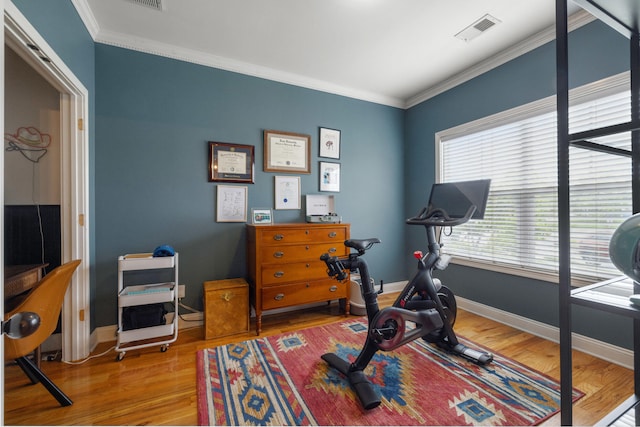 112 Woods Point Cir, Georgetown, KY 40324 - workout area with ornamental molding, wood finished floors, and baseboards