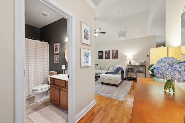 112 Woods Point Cir, Georgetown, KY 40324 - bathroom with vanity, toilet, ceiling fan, wood finished floors, and a shower with shower curtain