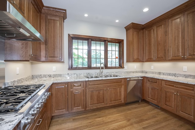804 Old Dobbin Rd, Lexington, KY 40502 - kitchen featuring extractor fan, stainless steel appliances, a sink, brown cabinets, and light stone countertops