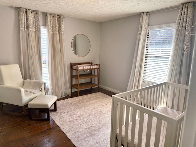 100 Cave Run Rd, Frankfort, KY 40601 - bedroom featuring hardwood / wood-style flooring, a textured ceiling, and baseboards