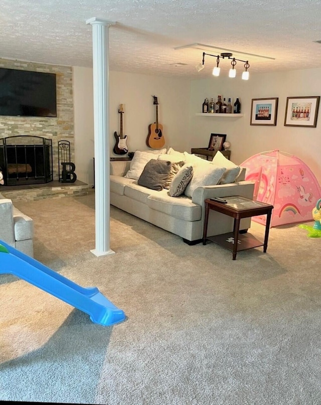 100 Cave Run Rd, Frankfort, KY 40601 - living area featuring carpet floors, a textured ceiling, and a stone fireplace