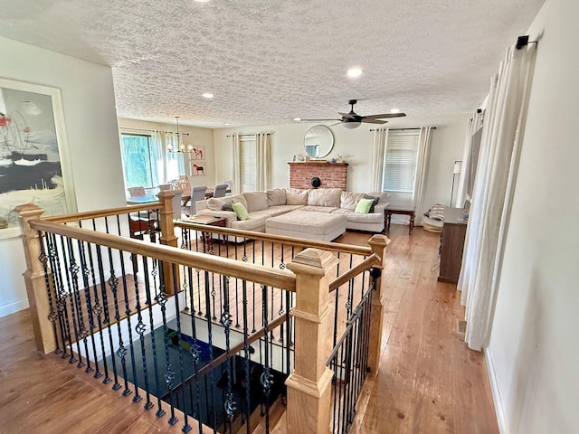 100 Cave Run Rd, Frankfort, KY 40601 - living area with baseboards, light wood-style flooring, a ceiling fan, a textured ceiling, and recessed lighting