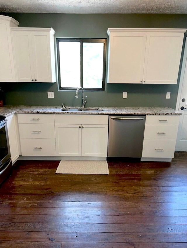 100 Cave Run Rd, Frankfort, KY 40601 - kitchen with stainless steel dishwasher, a sink, white cabinetry, dark wood-type flooring, and a textured ceiling