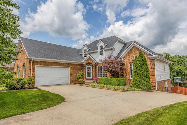 209 Juniper Dr, Nicholasville, KY 40356 - traditional home with brick siding, driveway, a garage, and roof with shingles
