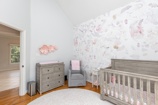 209 Juniper Dr, Nicholasville, KY 40356 - bedroom featuring a crib, wood finished floors, baseboards, and high vaulted ceiling