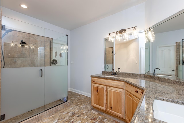 209 Juniper Dr, Nicholasville, KY 40356 - bathroom with double vanity, a shower stall, baseboards, and recessed lighting