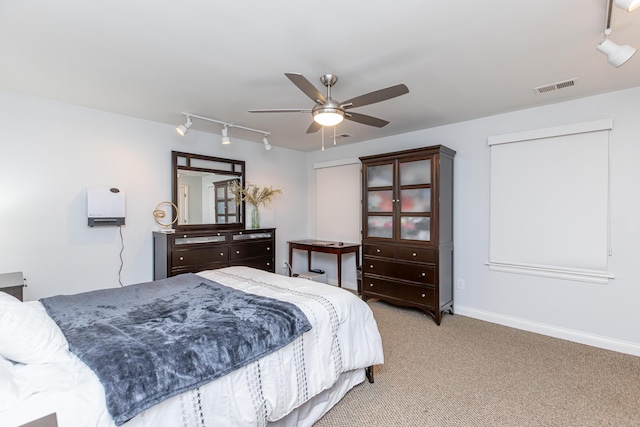 209 Juniper Dr, Nicholasville, KY 40356 - bedroom with track lighting, light carpet, a ceiling fan, and baseboards
