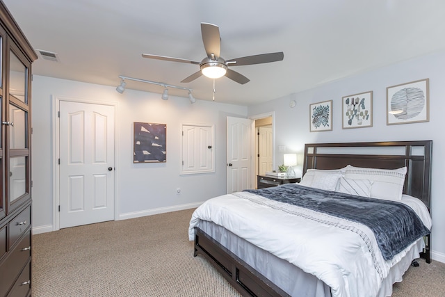 209 Juniper Dr, Nicholasville, KY 40356 - bedroom featuring rail lighting, carpet, baseboards, and ceiling fan