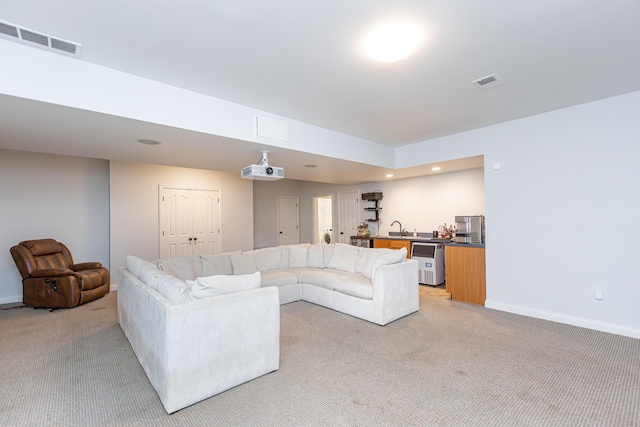 209 Juniper Dr, Nicholasville, KY 40356 - living area with light carpet, baseboards, wine cooler, and recessed lighting