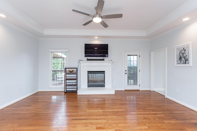 209 Juniper Dr, Nicholasville, KY 40356 - unfurnished living room featuring light wood-type flooring, a fireplace, ceiling fan, ornamental molding, and baseboards