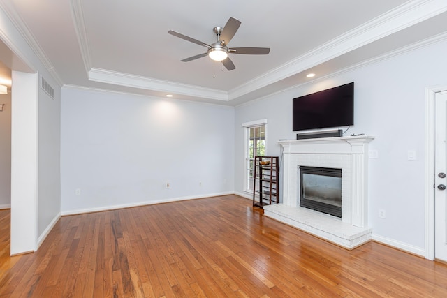 209 Juniper Dr, Nicholasville, KY 40356 - unfurnished living room with a raised ceiling, hardwood / wood-style flooring, a ceiling fan, ornamental molding, and baseboards