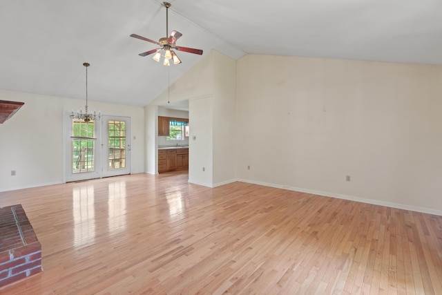 113 Alta Dr, Lawrenceburg, KY 40342 - unfurnished living room featuring ceiling fan, a chandelier, light wood-type flooring, high vaulted ceiling, and baseboards