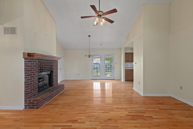 113 Alta Dr, Lawrenceburg, KY 40342 - unfurnished living room featuring ceiling fan, a fireplace, light wood-style floors, high vaulted ceiling, and baseboards
