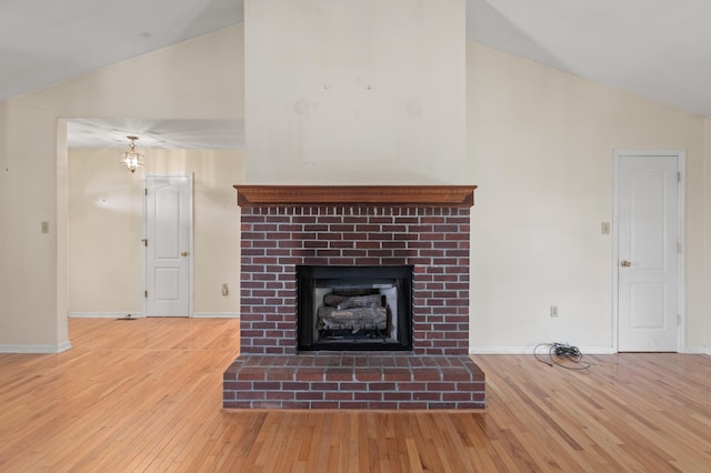 113 Alta Dr, Lawrenceburg, KY 40342 - unfurnished living room with high vaulted ceiling, hardwood / wood-style flooring, a fireplace, and baseboards