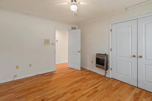 113 Alta Dr, Lawrenceburg, KY 40342 - unfurnished bedroom featuring heating unit, light wood-style floors, crown molding, baseboards, and ceiling fan