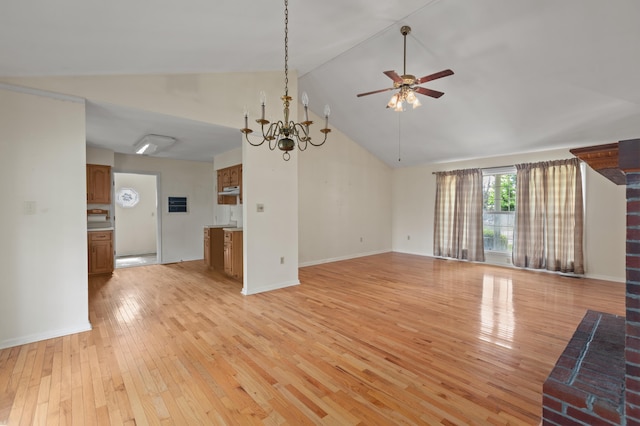 113 Alta Dr, Lawrenceburg, KY 40342 - unfurnished living room with ceiling fan, light wood-style flooring, high vaulted ceiling, a chandelier, and baseboards