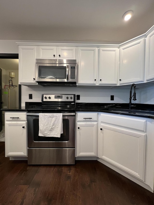 101 Dorset Ln, Winchester, KY 40391 - kitchen with stainless steel appliances, white cabinets, and dark wood finished floors