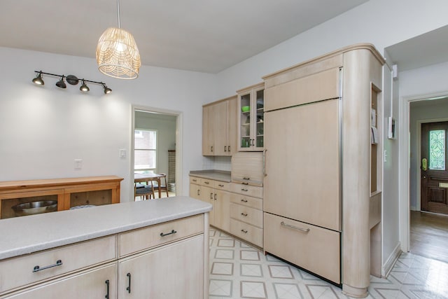 339 Greenbriar Rd, Lexington, KY 40503 - kitchen featuring paneled built in fridge, light countertops, light floors, and glass insert cabinets