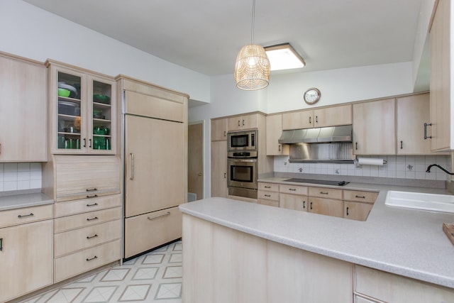 339 Greenbriar Rd, Lexington, KY 40503 - kitchen featuring light brown cabinetry, built in appliances, a sink, and under cabinet range hood