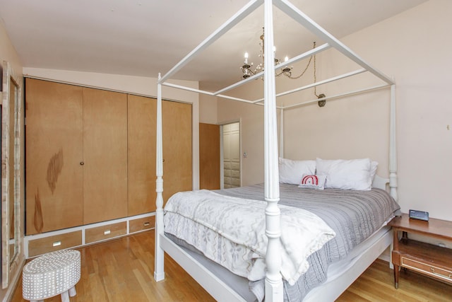 339 Greenbriar Rd, Lexington, KY 40503 - bedroom featuring wood finished floors and a chandelier