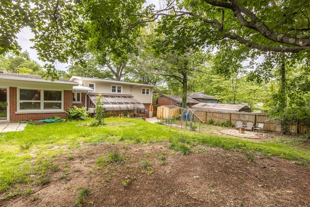 339 Greenbriar Rd, Lexington, KY 40503 - view of yard with a greenhouse and a patio