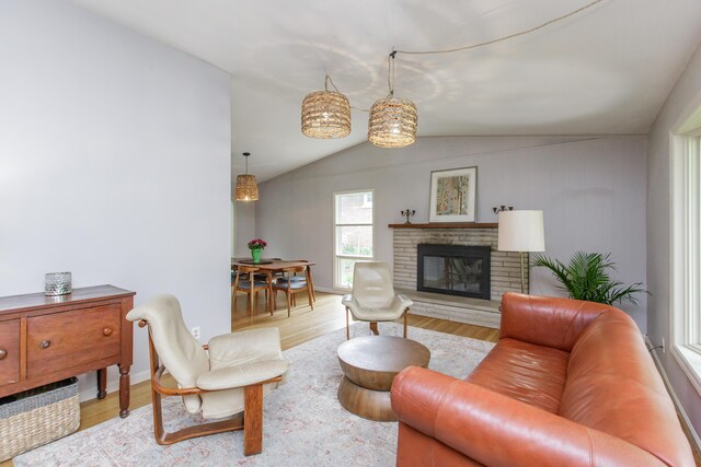 339 Greenbriar Rd, Lexington, KY 40503 - living area featuring vaulted ceiling, wood finished floors, and a fireplace