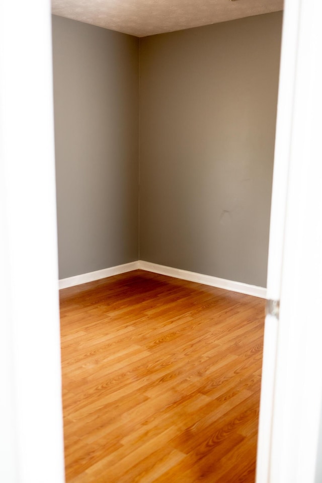 144 Williamsburg Ln, Georgetown, KY 40324 - empty room with light wood-type flooring and baseboards