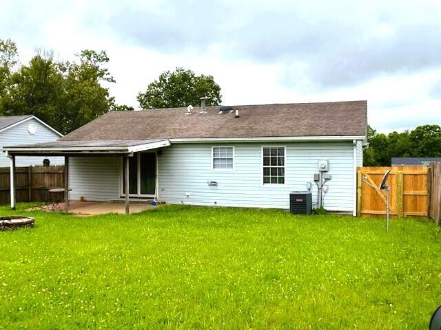 144 Williamsburg Ln, Georgetown, KY 40324 - rear view of property featuring a patio area and a gate