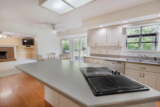 6011 Canonero Way, Versailles, KY 40383 - kitchen featuring ceiling fan, dishwashing machine, a sink, a center island, and open floor plan