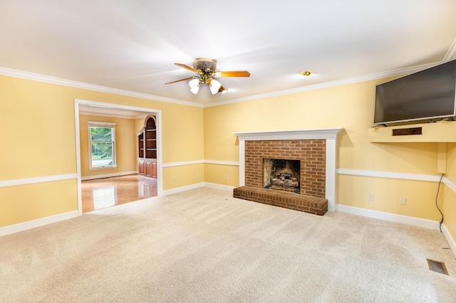 6011 Canonero Way, Versailles, KY 40383 - unfurnished living room with carpet floors, a ceiling fan, crown molding, baseboards, and a brick fireplace
