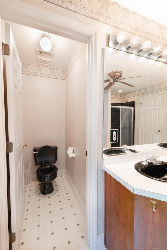 6011 Canonero Way, Versailles, KY 40383 - bathroom with tile patterned floors, vanity, ceiling fan, baseboards, and toilet
