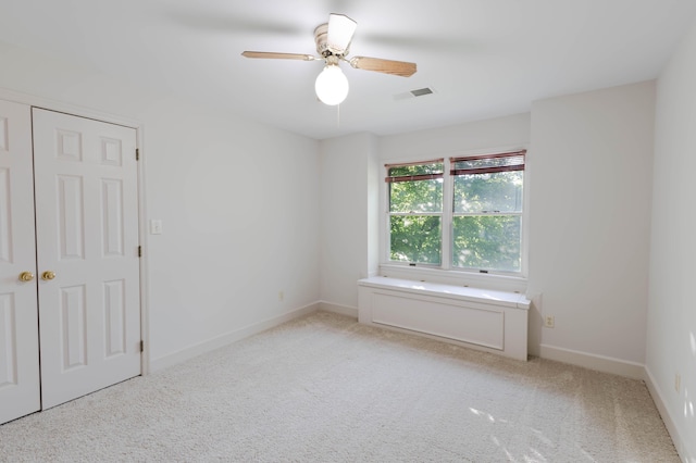 6011 Canonero Way, Versailles, KY 40383 - empty room featuring light carpet, ceiling fan, and baseboards