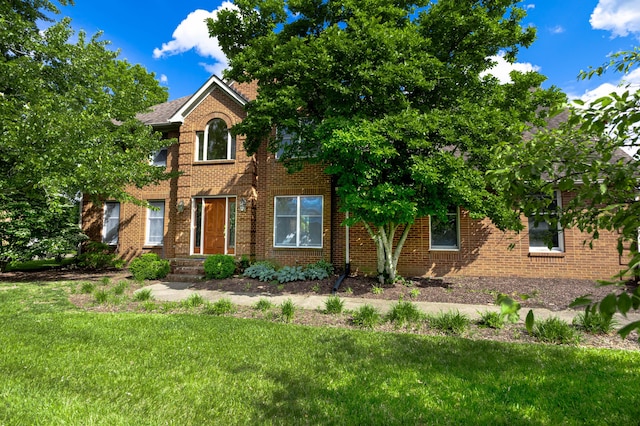 6011 Canonero Way, Versailles, KY 40383 - view of front facade with a front lawn and brick siding