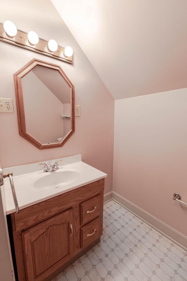 6011 Canonero Way, Versailles, KY 40383 - bathroom featuring vaulted ceiling, vanity, tile patterned floors, and baseboards