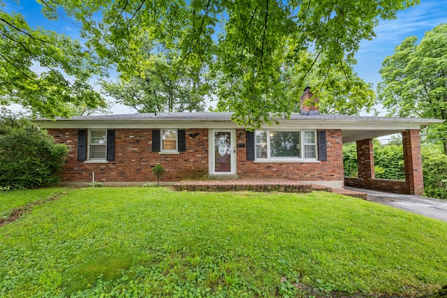 1023 Chickasaw Trl, Frankfort, KY 40601 - ranch-style home featuring a chimney, a front yard, brick siding, and driveway