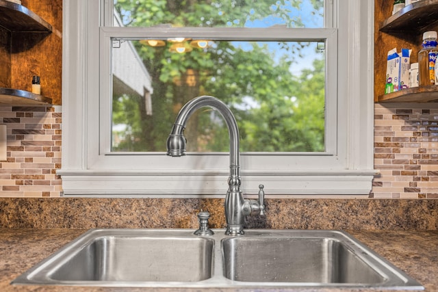 1023 Chickasaw Trl, Frankfort, KY 40601 - kitchen featuring appliances with stainless steel finishes, open shelves, a sink, light wood-style flooring, and backsplash
