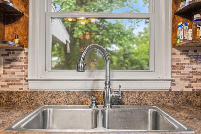 1023 Chickasaw Trl, Frankfort, KY 40601 - kitchen featuring appliances with stainless steel finishes, open shelves, a sink, light wood-style flooring, and backsplash