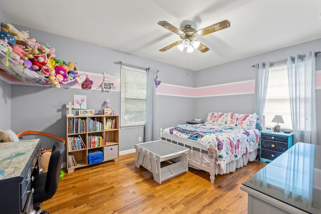 1023 Chickasaw Trl, Frankfort, KY 40601 - bedroom with light wood-type flooring, a ceiling fan, and baseboards