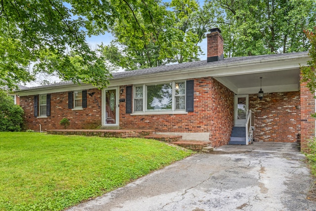1023 Chickasaw Trl, Frankfort, KY 40601 - ranch-style house with a front yard, a chimney, and brick siding