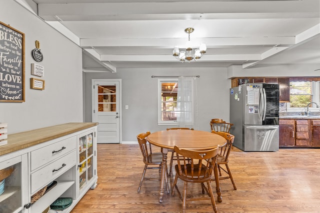 1023 Chickasaw Trl, Frankfort, KY 40601 - dining area featuring beam ceiling, light wood-style floors, a chandelier, and beverage cooler