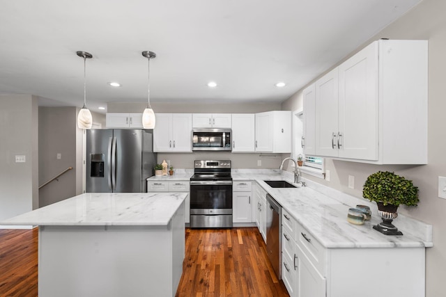 2849 Walnut Hill Rd, Lexington, KY 40515 - kitchen featuring stainless steel appliances, a sink, a kitchen island, light stone countertops, and recessed lighting