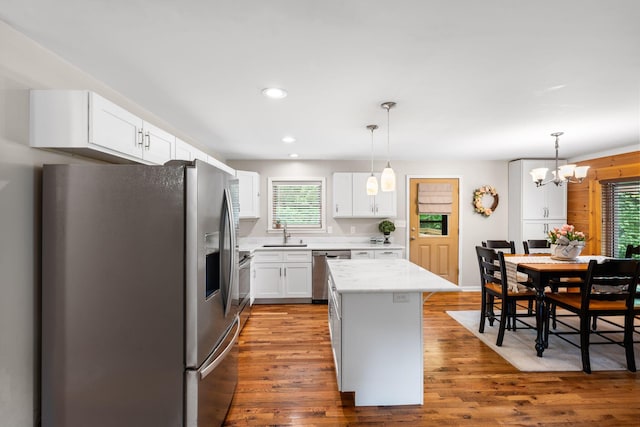 2849 Walnut Hill Rd, Lexington, KY 40515 - kitchen with appliances with stainless steel finishes, wood finished floors, plenty of natural light, white cabinetry, and recessed lighting