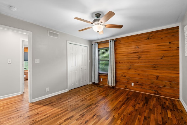 2849 Walnut Hill Rd, Lexington, KY 40515 - unfurnished bedroom with wood-type flooring, a closet, a ceiling fan, and baseboards