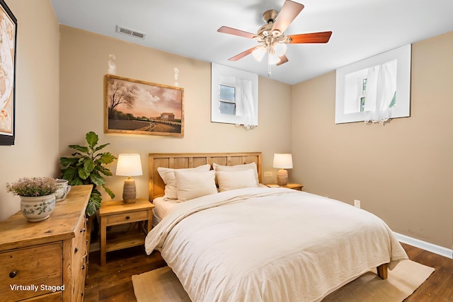 2849 Walnut Hill Rd, Lexington, KY 40515 - bedroom featuring dark wood-style floors, a ceiling fan, and baseboards