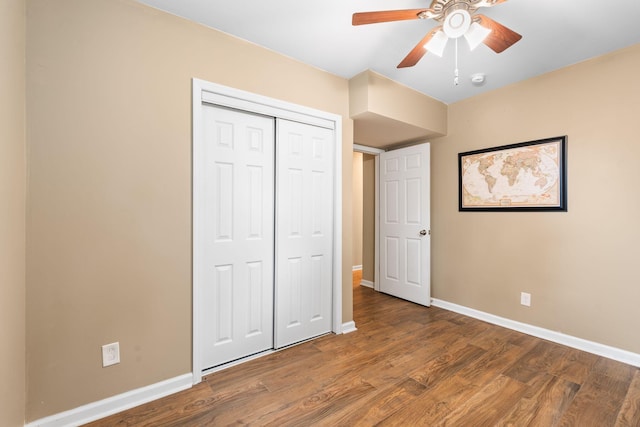 2849 Walnut Hill Rd, Lexington, KY 40515 - unfurnished bedroom featuring baseboards, wood finished floors, a closet, and ceiling fan