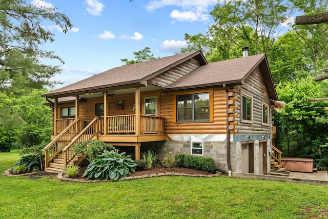 2849 Walnut Hill Rd, Lexington, KY 40515 - view of front of property with a hot tub, log siding, a garage, a front lawn, and stairs