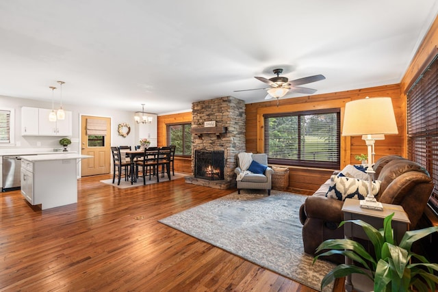 2849 Walnut Hill Rd, Lexington, KY 40515 - living area featuring plenty of natural light, a fireplace, wooden walls, ceiling fan, and wood-type flooring